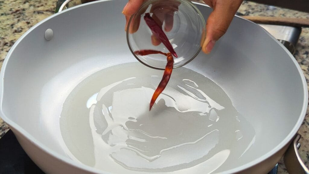 Dry Red Chilis to the hot oil