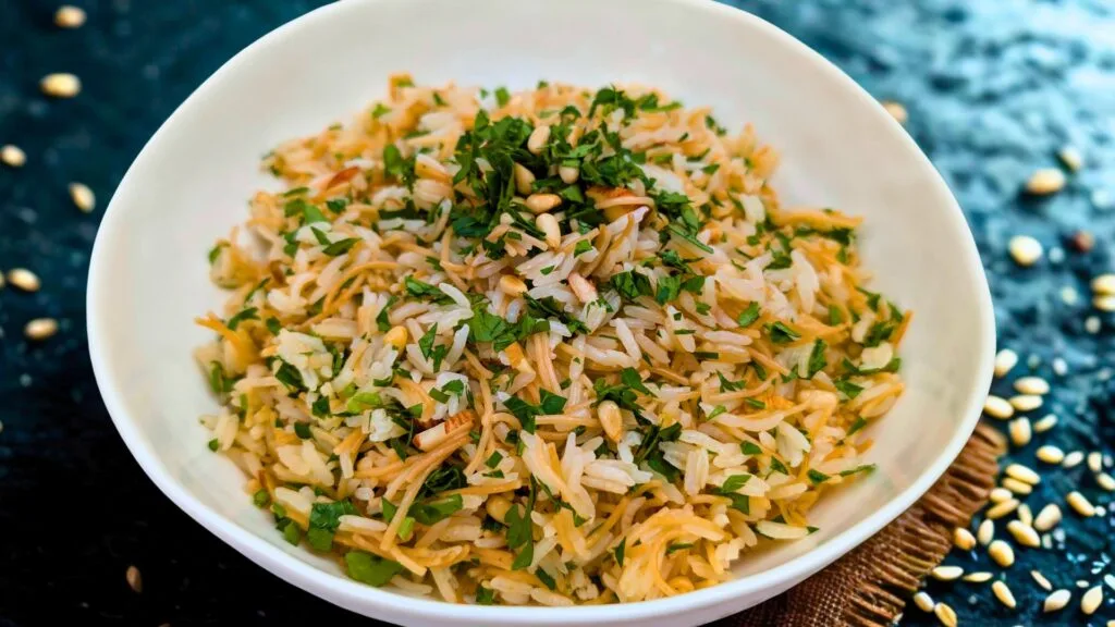 Lebanese Rice in a white bowl with a black background