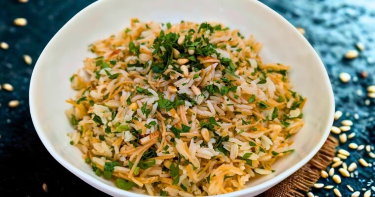 Lebanese Rice in a white bowl with a black background