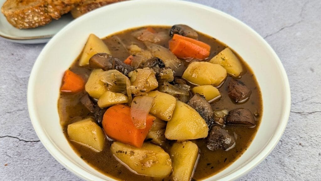 Mushroom Potato Stew served in a white bowl