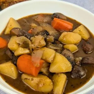 Mushroom Potato Stew served in a white bowl