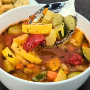 Tomato Vegetable Soup served in white bowl